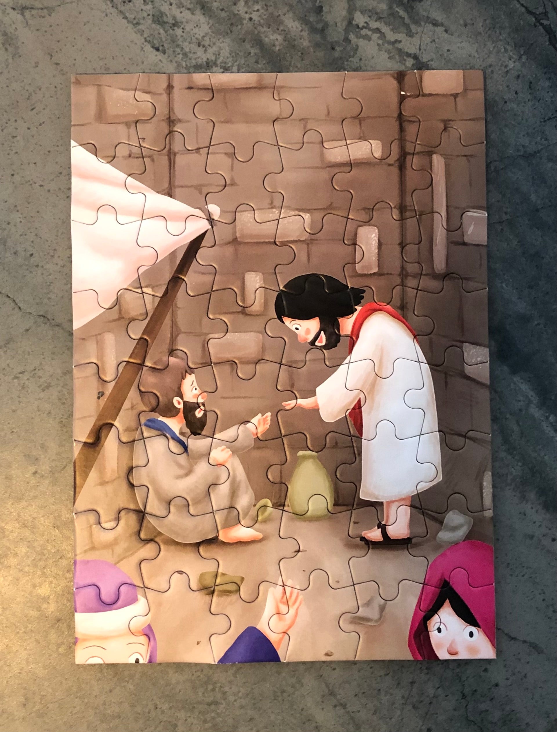Christian children's book bundle featuring an illustrated puzzle scene of Jesus helping a man in need