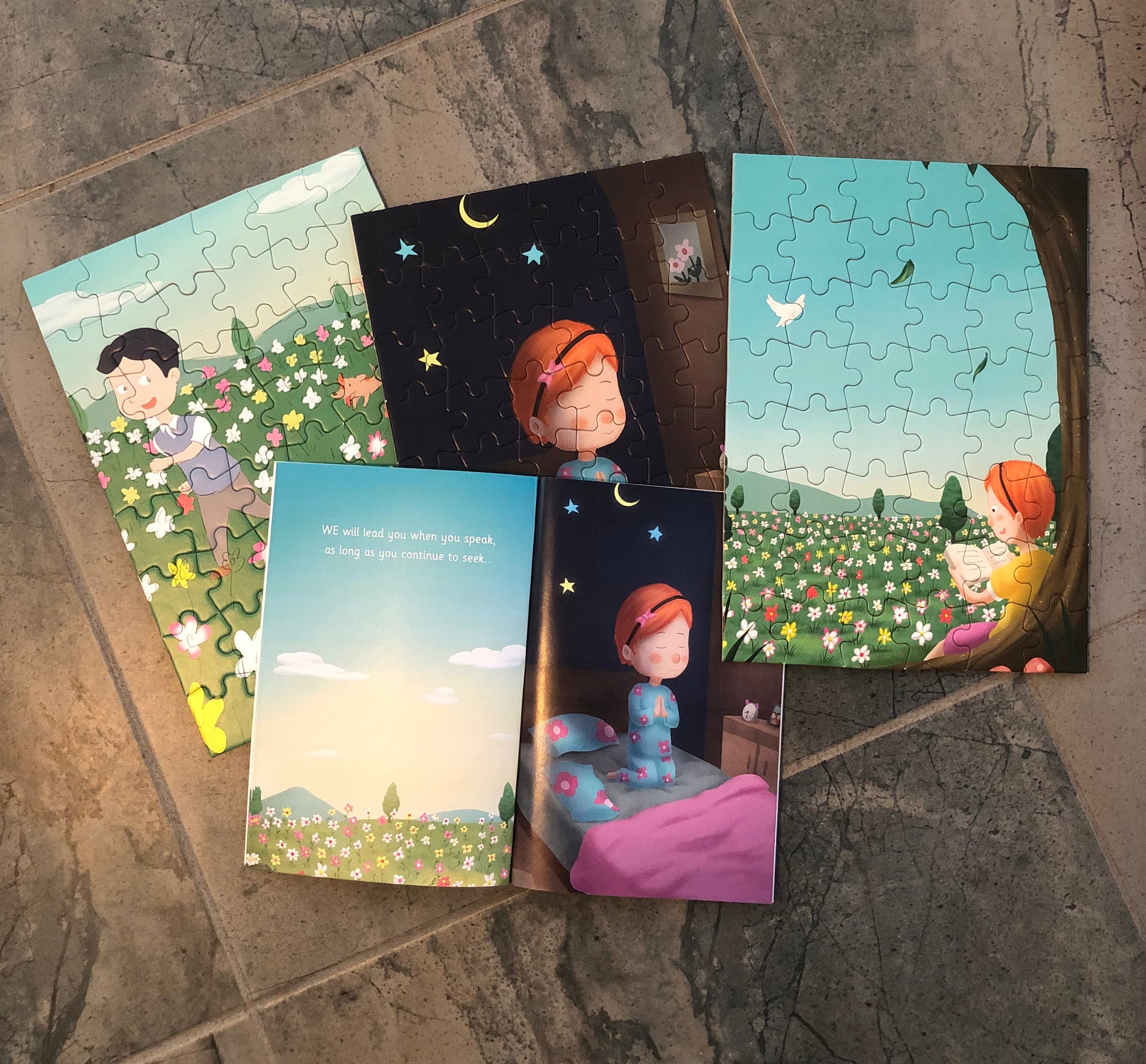 Colorful storytelling themed jigsaw puzzle featuring children in a whimsical landscape